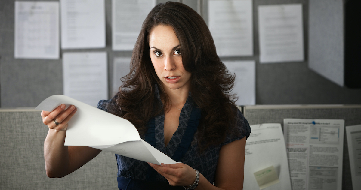 woman holding script